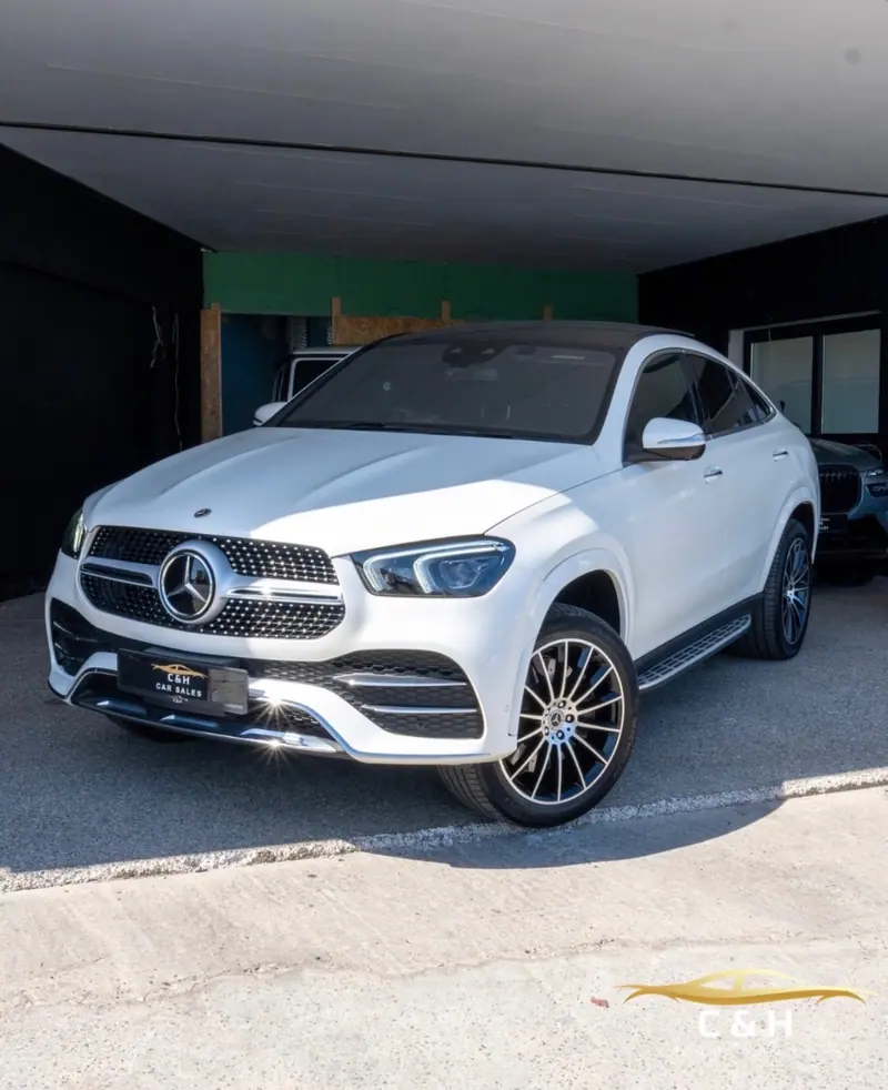 White Mercedes coupé SUV in the C&H Car Sales showroom